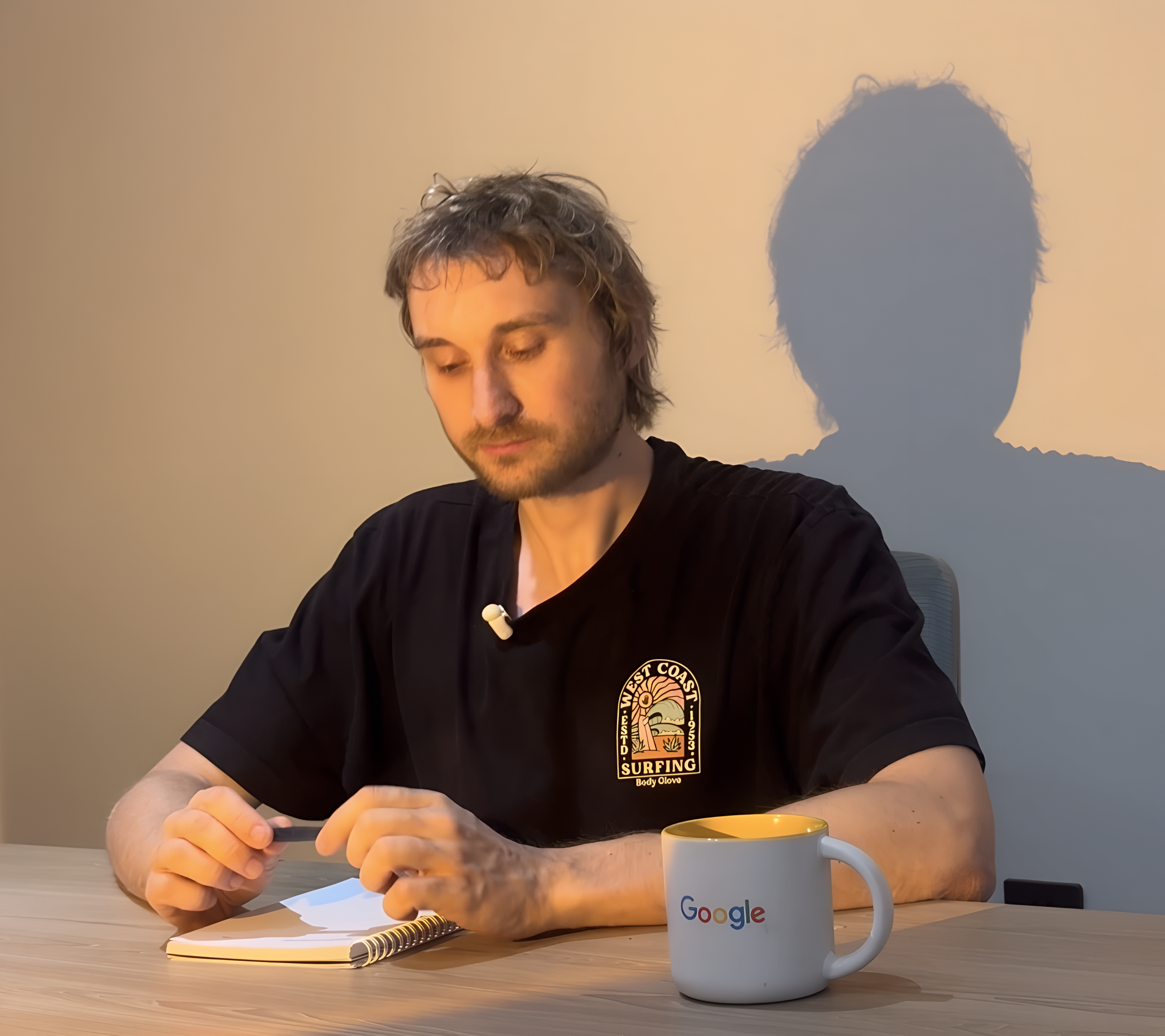 Nick Berns, founder of Bluelight, taking notes at a desk
