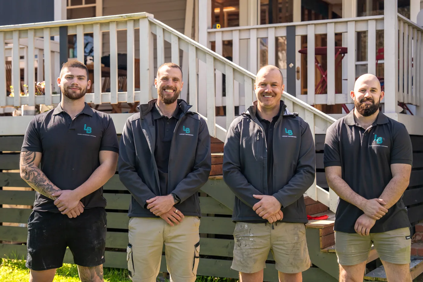 The Luxury Bathrooms team outside a finished home
